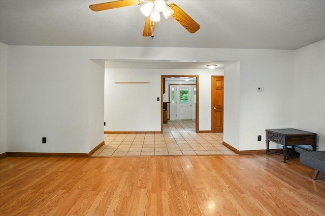 473 Davenport Hill Rd, Jay, ME 04239 - unfurnished room featuring light wood finished floors, baseboards, and ceiling fan