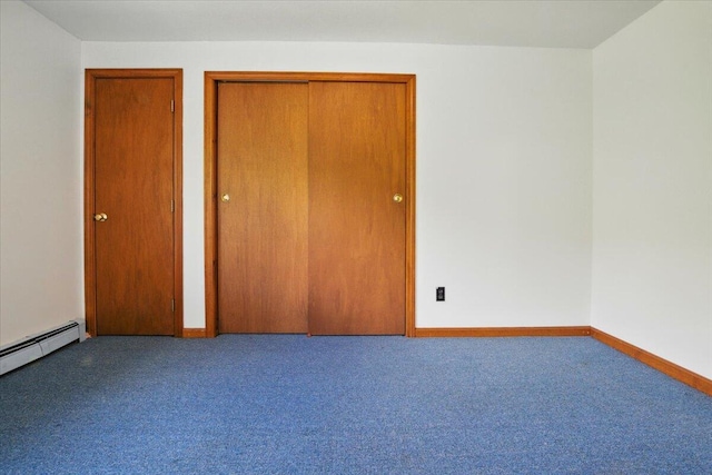 473 Davenport Hill Rd, Jay, ME 04239 - unfurnished bedroom with carpet flooring, a baseboard radiator, and baseboards