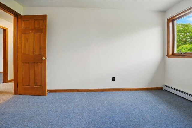 473 Davenport Hill Rd, Jay, ME 04239 - carpeted spare room with baseboards and a baseboard heating unit