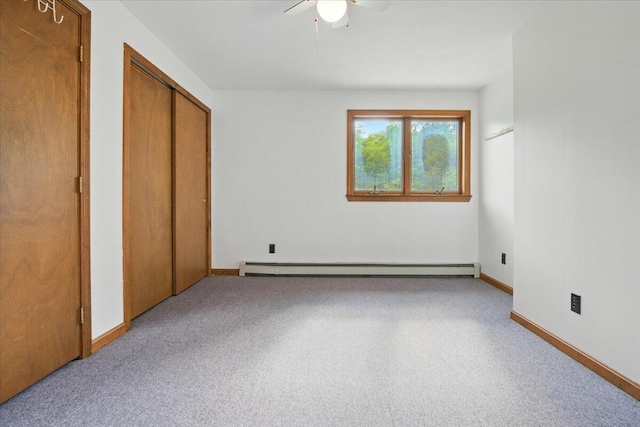 473 Davenport Hill Rd, Jay, ME 04239 - unfurnished bedroom featuring carpet flooring, baseboard heating, baseboards, and ceiling fan