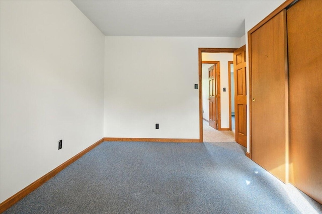 473 Davenport Hill Rd, Jay, ME 04239 - unfurnished bedroom featuring carpet, baseboards, and a closet