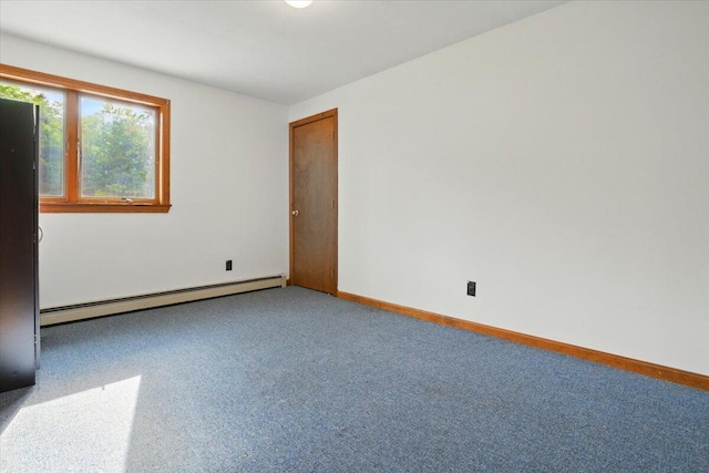 473 Davenport Hill Rd, Jay, ME 04239 - carpeted empty room with a baseboard heating unit and baseboards