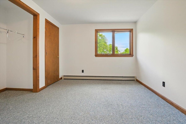 473 Davenport Hill Rd, Jay, ME 04239 - unfurnished bedroom with a baseboard radiator, carpet, and baseboards
