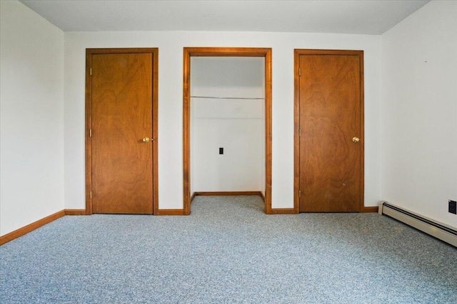 473 Davenport Hill Rd, Jay, ME 04239 - unfurnished bedroom featuring carpet floors, baseboard heating, baseboards, and multiple closets