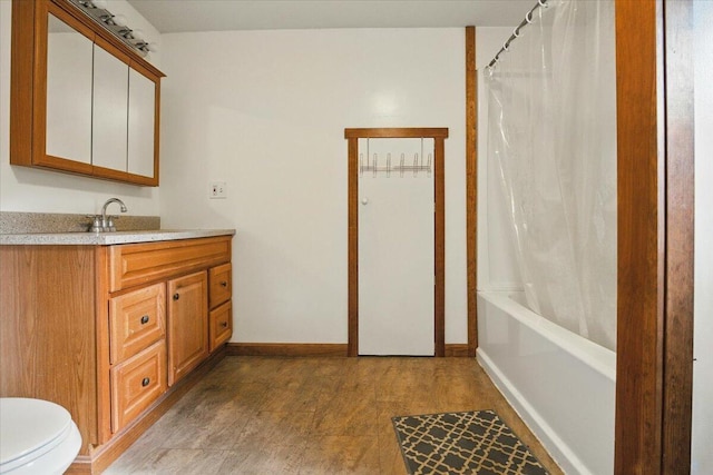 473 Davenport Hill Rd, Jay, ME 04239 - bathroom featuring vanity, toilet, baseboards, and shower / tub combo with curtain