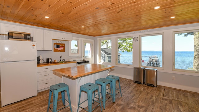 1491 Richville Rd, Standish, ME 04084 - kitchen featuring freestanding refrigerator, butcher block counters, wooden ceiling, white cabinetry, and stainless steel microwave