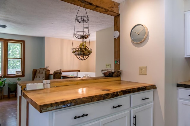 1007 Old Stage Rd, Woolwich, ME 04579 - kitchen with butcher block countertops, white cabinets, and dark wood-style flooring