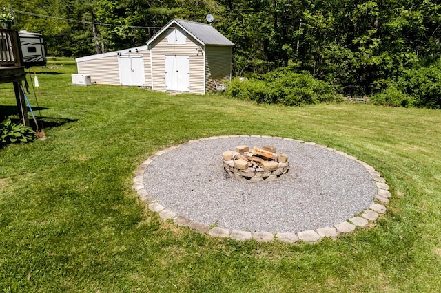 1007 Old Stage Rd, Woolwich, ME 04579 - view of grassy yard with an outdoor fire pit