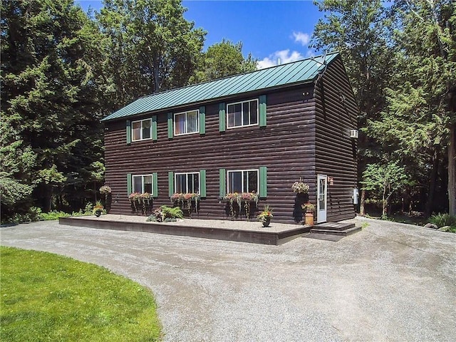 37 Loon Dr, Newport, ME 04953 - chalet / cabin featuring a standing seam roof, metal roof, driveway, and log veneer siding