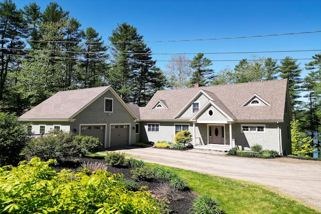 42 Chickering Rd, Nobleboro, ME 04555 - shingle-style home featuring driveway, a garage, roof with shingles, and a chimney