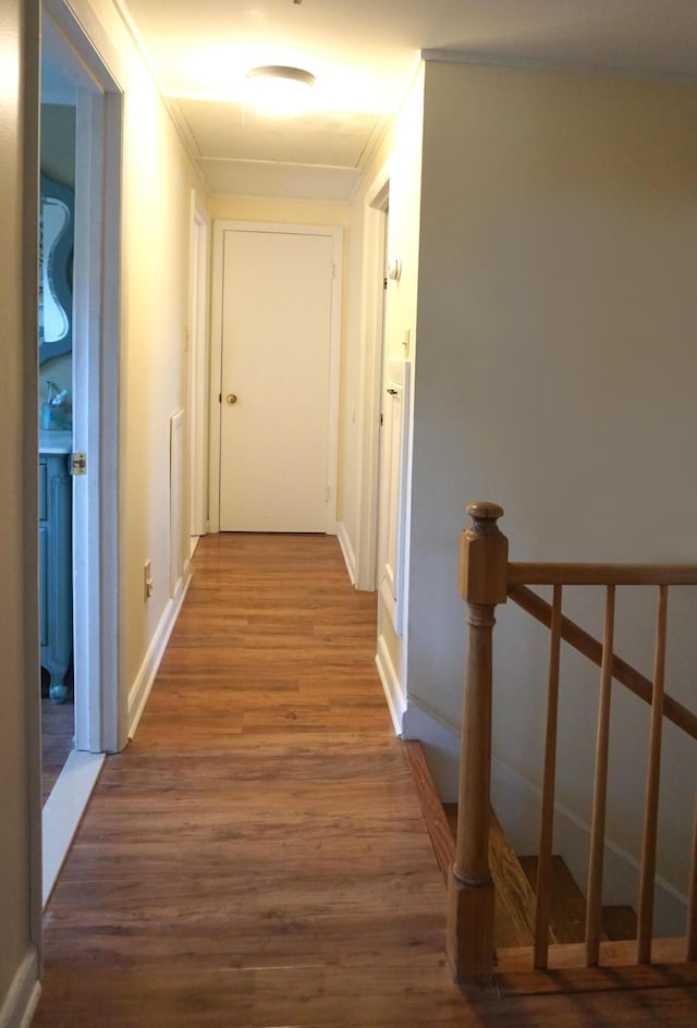 27 Misty Harbor Ln Unit 210, Cutler, ME 04626 - corridor with an upstairs landing, wood finished floors, and baseboards