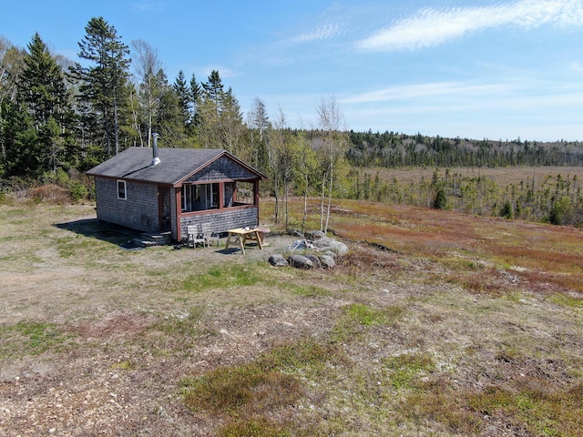 M2L3-M6L16 Campbell Rd, Whiting, ME 04691 - back of property featuring a wooded view