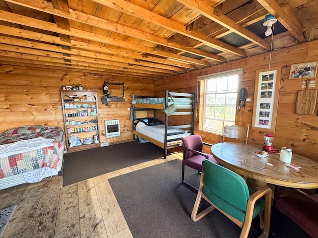 M2L3-M6L16 Campbell Rd, Whiting, ME 04691 - bedroom featuring heating unit, wood-type flooring, and wood walls