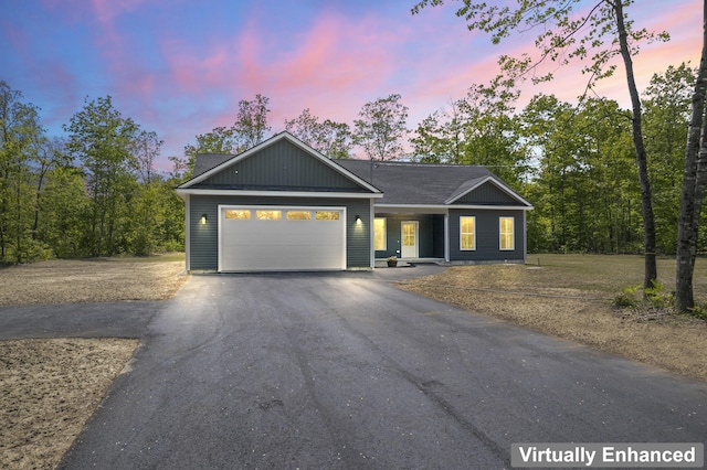 25 Sarah Vaughn Rd, Hollis, ME 04042 - ranch-style home with driveway and a garage