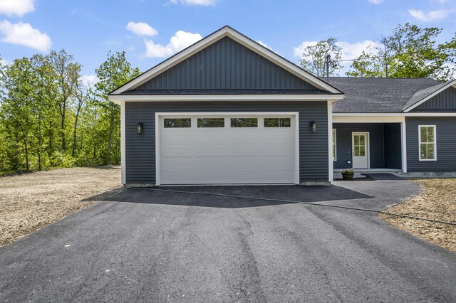 25 Sarah Vaughn Rd, Hollis, ME 04042 - view of front of house with driveway, a garage, and a shingled roof