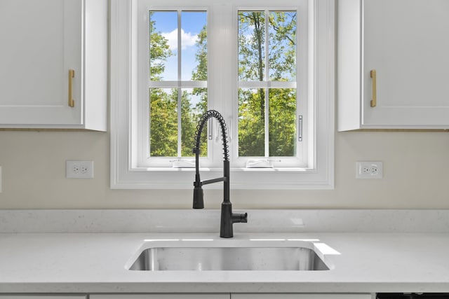 25 Sarah Vaughn Rd, Hollis, ME 04042 - kitchen view of a sink and white cabinetry