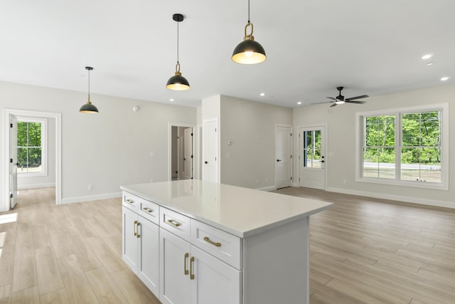 25 Sarah Vaughn Rd, Hollis, ME 04042 - kitchen featuring light wood-style flooring, baseboards, a center island, and recessed lighting