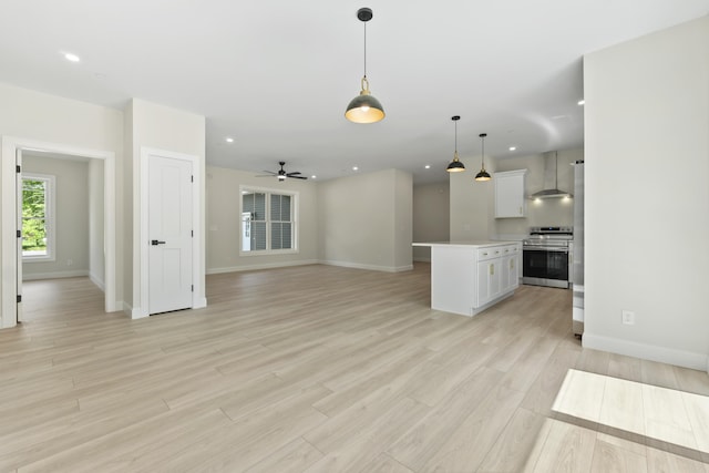 25 Sarah Vaughn Rd, Hollis, ME 04042 - unfurnished living room with baseboards, light wood-style flooring, recessed lighting, and ceiling fan