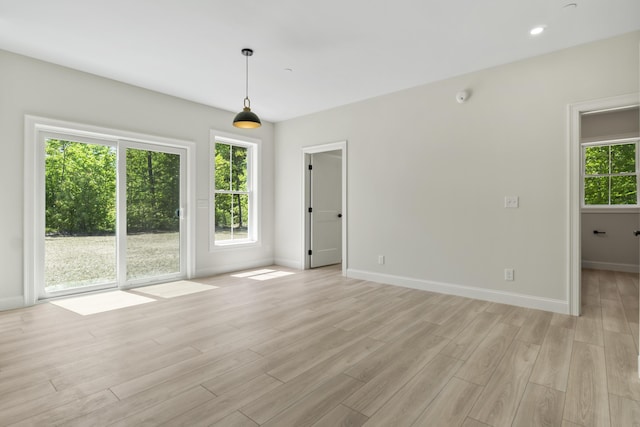 25 Sarah Vaughn Rd, Hollis, ME 04042 - empty room with baseboards, light wood-style floors, recessed lighting, and a smoke detector
