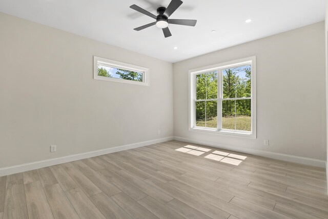 25 Sarah Vaughn Rd, Hollis, ME 04042 - empty room featuring baseboards, light wood-style floors, a ceiling fan, and recessed lighting
