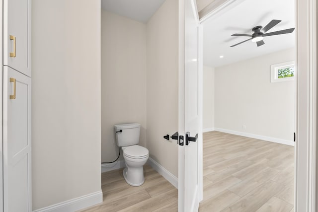 25 Sarah Vaughn Rd, Hollis, ME 04042 - bathroom featuring toilet, wood finished floors, a ceiling fan, and baseboards