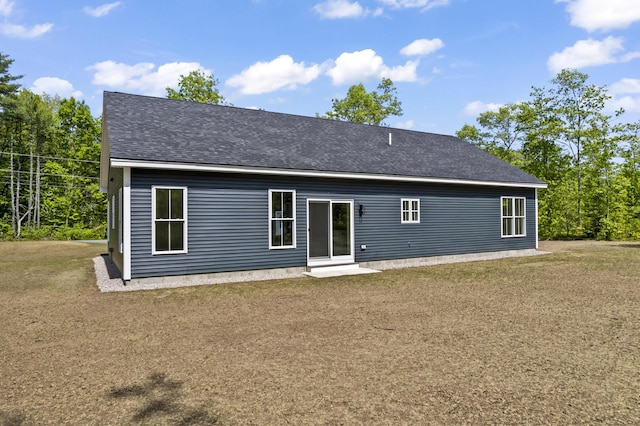 25 Sarah Vaughn Rd, Hollis, ME 04042 - back of property with a yard and roof with shingles
