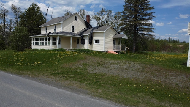 61 Brook Rd, Saint Agatha, ME 04772 - farmhouse inspired home with a chimney, a sunroom, and a front yard