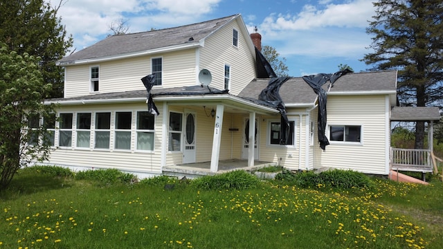 61 Brook Rd, Saint Agatha, ME 04772 - rear view of house featuring a yard, a porch, and a chimney