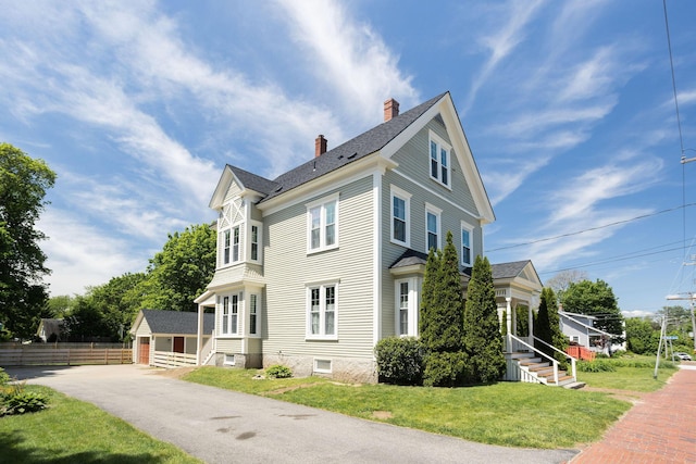 205 Beach St, Saco, ME 04072 - view of side of property with a chimney