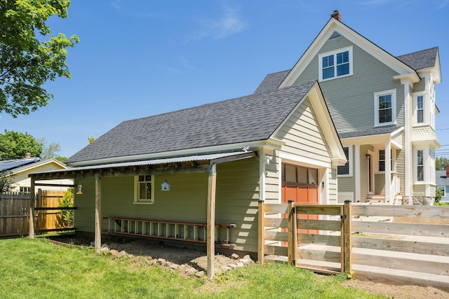 205 Beach St, Saco, ME 04072 - view of front facade featuring a shingled roof, a garage, and covered porch