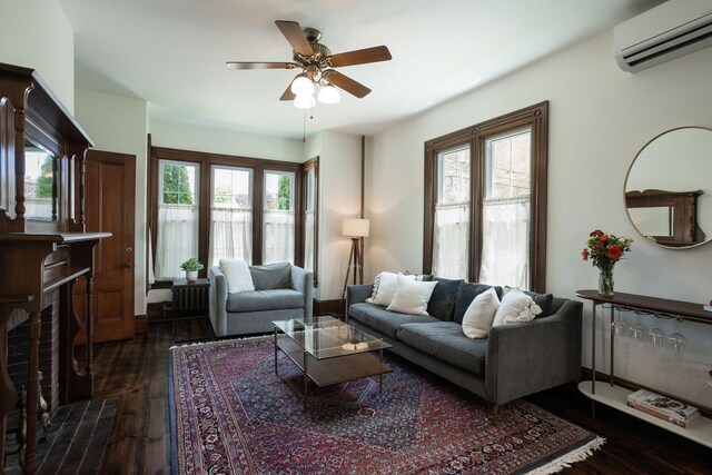 205 Beach St, Saco, ME 04072 - living room featuring a wall unit AC, a ceiling fan, and dark wood-style floors