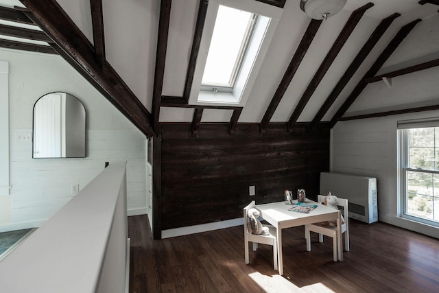 205 Beach St, Saco, ME 04072 - dining area featuring a skylight, heating unit, dark wood finished floors, and wooden walls