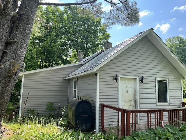 700 Warren Hill Rd, Palmyra, ME 04965 - back of property featuring heating fuel and a chimney