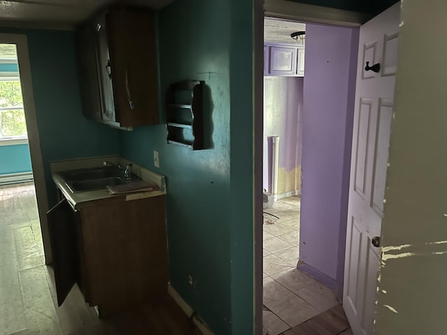 700 Warren Hill Rd, Palmyra, ME 04965 - kitchen featuring a sink and baseboard heating