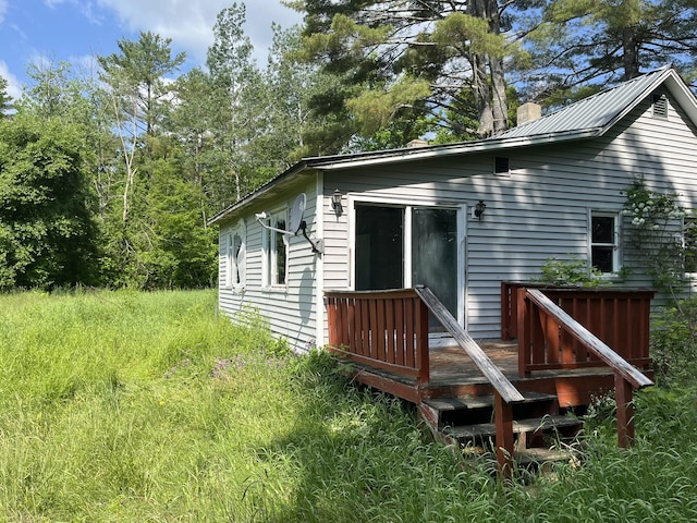 700 Warren Hill Rd, Palmyra, ME 04965 - rear view of property with a chimney and a deck