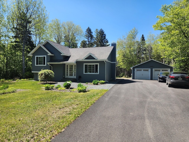 34 Sandy Acres Dr, Sullivan, ME 04664 - tri-level home with a garage, a chimney, an outdoor structure, a front lawn, and french doors
