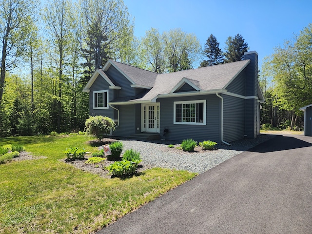 34 Sandy Acres Dr, Sullivan, ME 04664 - view of front facade featuring a chimney, a front yard, and roof with shingles