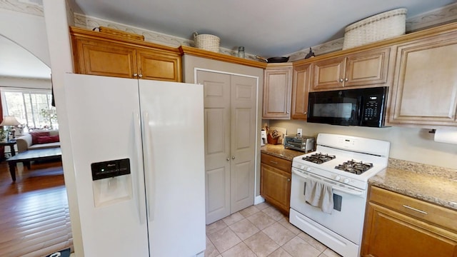 34 Sandy Acres Dr, Sullivan, ME 04664 - kitchen with white appliances, light stone counters, and light tile patterned flooring