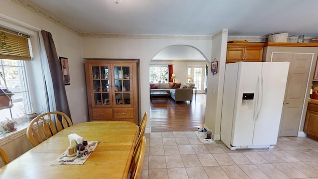 34 Sandy Acres Dr, Sullivan, ME 04664 - dining room with arched walkways and light tile patterned floors
