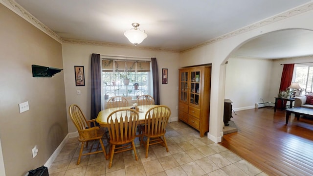 34 Sandy Acres Dr, Sullivan, ME 04664 - dining room with arched walkways and a baseboard radiator