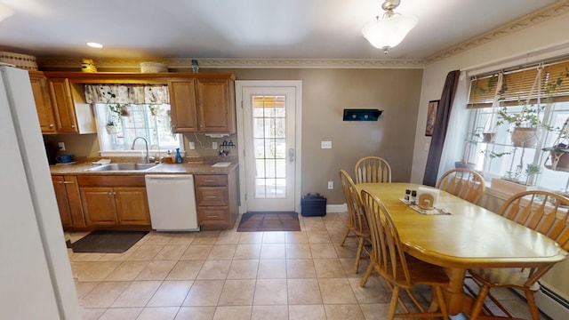 34 Sandy Acres Dr, Sullivan, ME 04664 - kitchen featuring white appliances, light tile patterned floors, brown cabinets, and light countertops