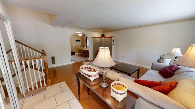 34 Sandy Acres Dr, Sullivan, ME 04664 - living area featuring arched walkways, stairs, and wood finished floors
