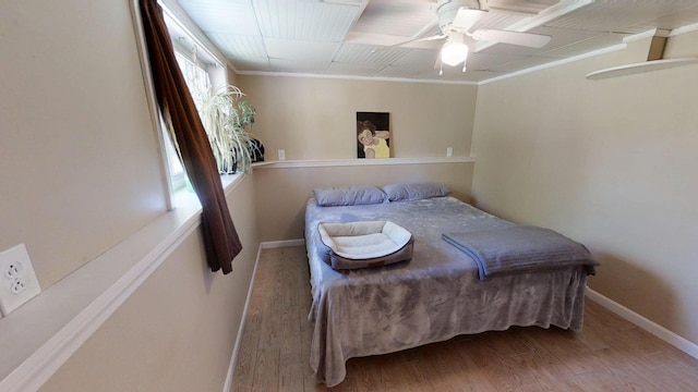 34 Sandy Acres Dr, Sullivan, ME 04664 - bedroom with wood finished floors, ceiling fan, and ornamental molding