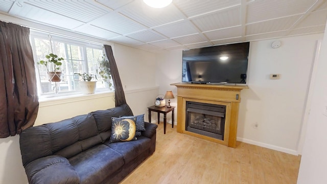 34 Sandy Acres Dr, Sullivan, ME 04664 - living room with wood finished floors and a fireplace
