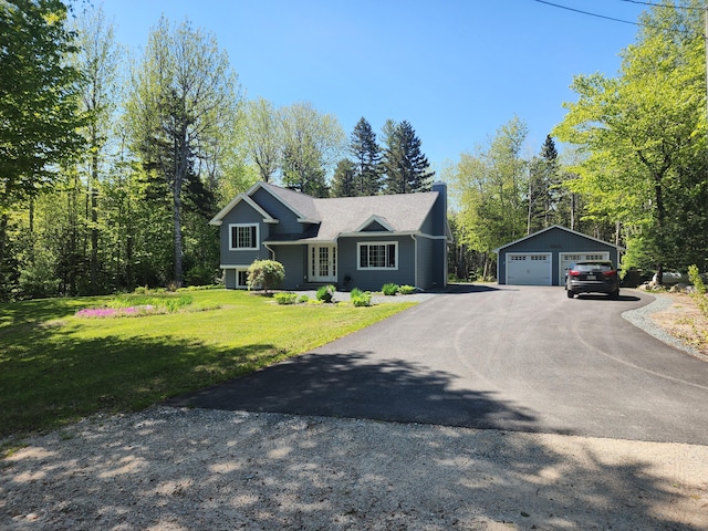 34 Sandy Acres Dr, Sullivan, ME 04664 - view of front of home with a detached garage, an outbuilding, and a front lawn
