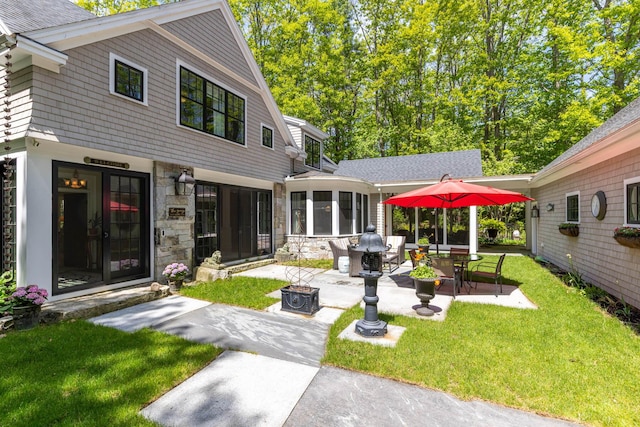 38 Darcy Rd, York, ME 03909 - back of house featuring a patio area, stone siding, a lawn, and a sunroom