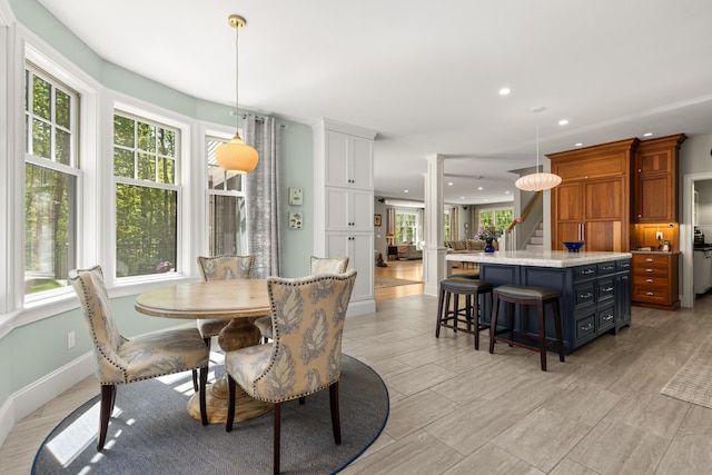38 Darcy Rd, York, ME 03909 - dining area featuring recessed lighting, decorative columns, stairway, and baseboards