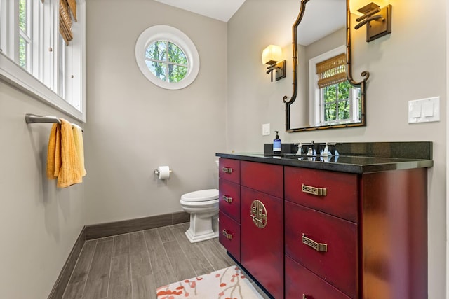 38 Darcy Rd, York, ME 03909 - bathroom featuring baseboards, healthy amount of natural light, wood tiled floors, and vanity