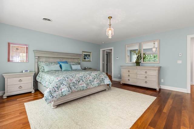 38 Darcy Rd, York, ME 03909 - bedroom with wood finished floors, baseboards, and a chandelier