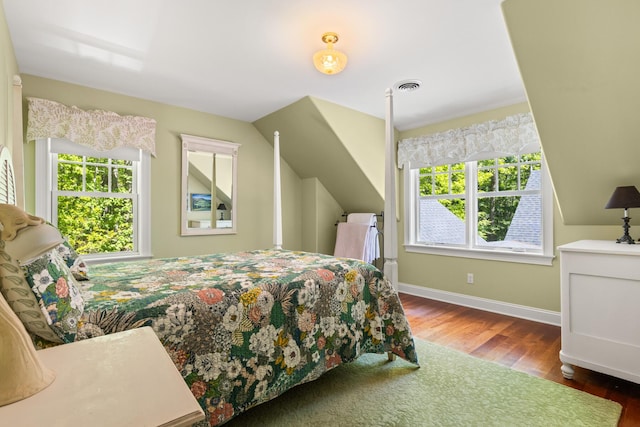 38 Darcy Rd, York, ME 03909 - bedroom featuring multiple windows, wood finished floors, baseboards, and lofted ceiling